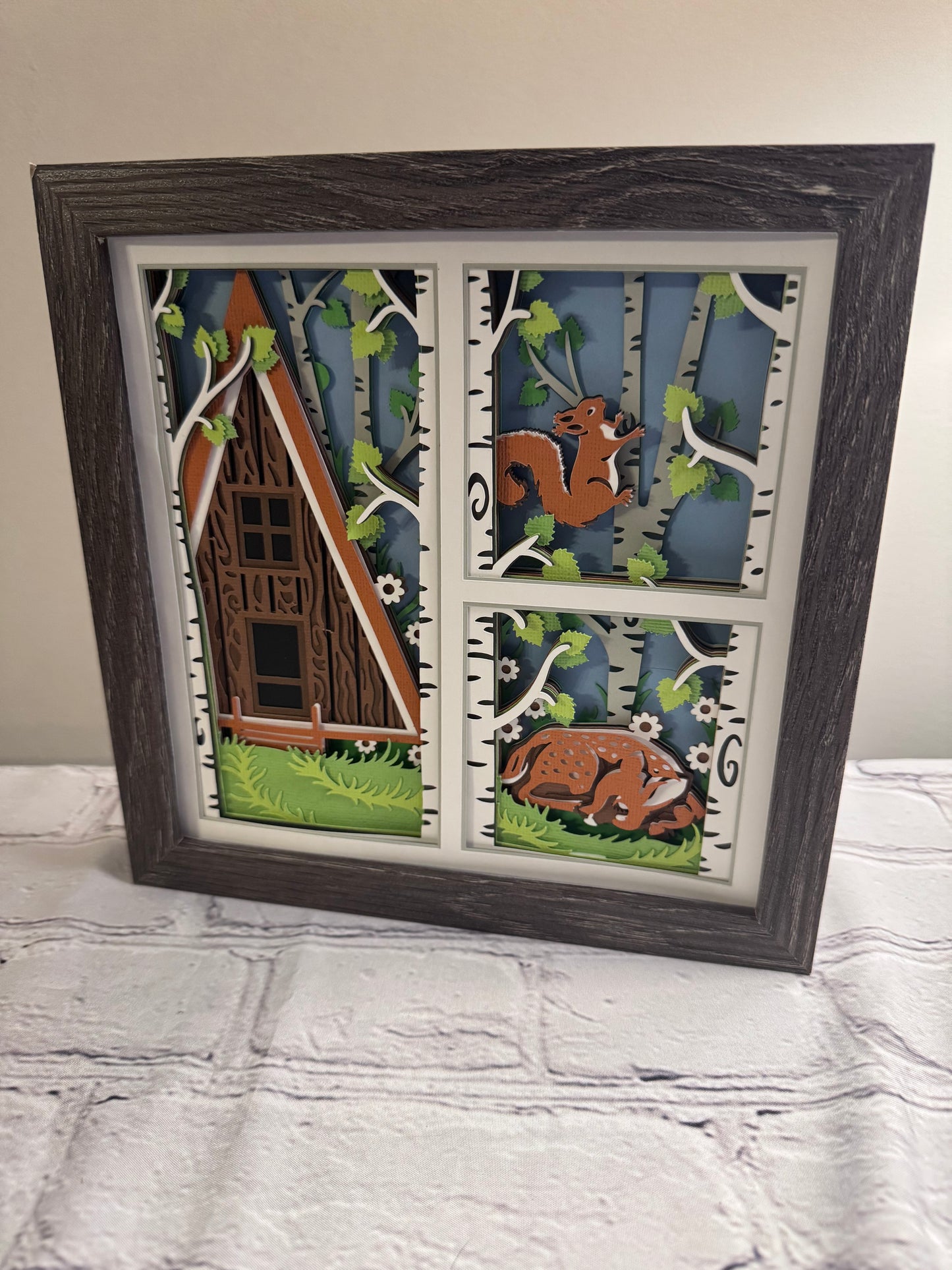 Spring cabin with fawn 3D paper art in a shadowbox