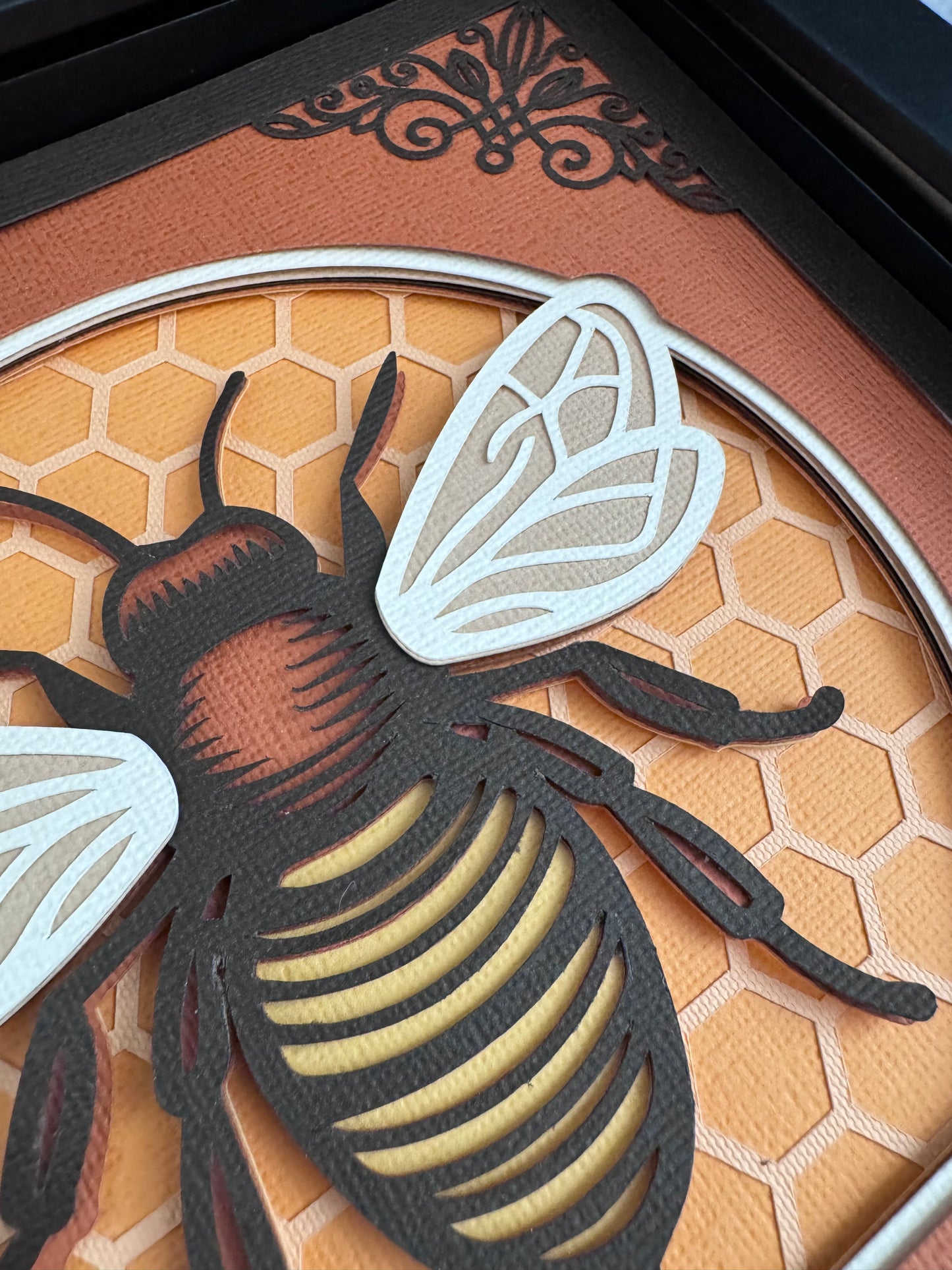 Intricate frame bumble bee 3D paper art in a shadowbox