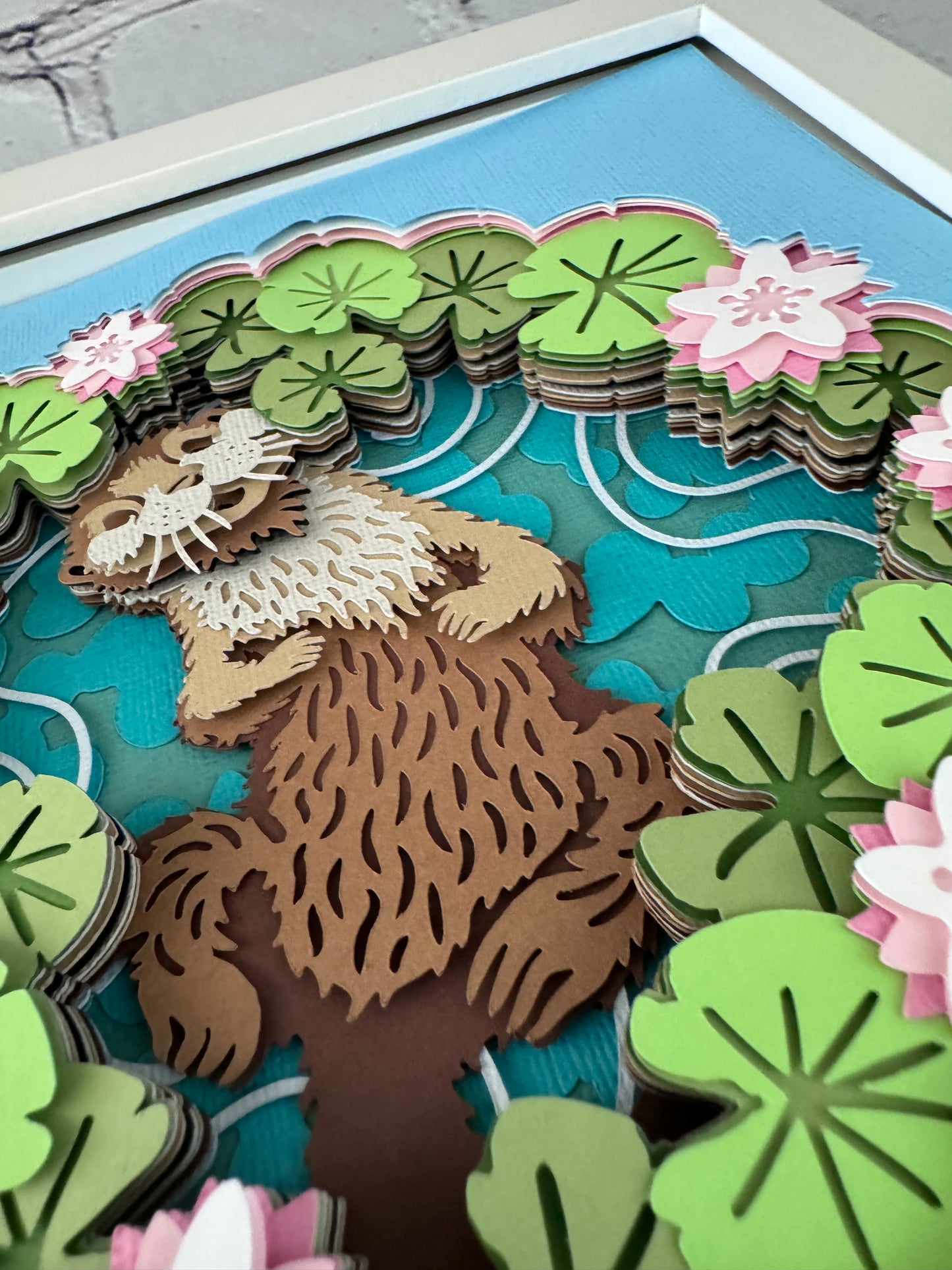 Otter with water lily design 3D paper art in a shadowbox