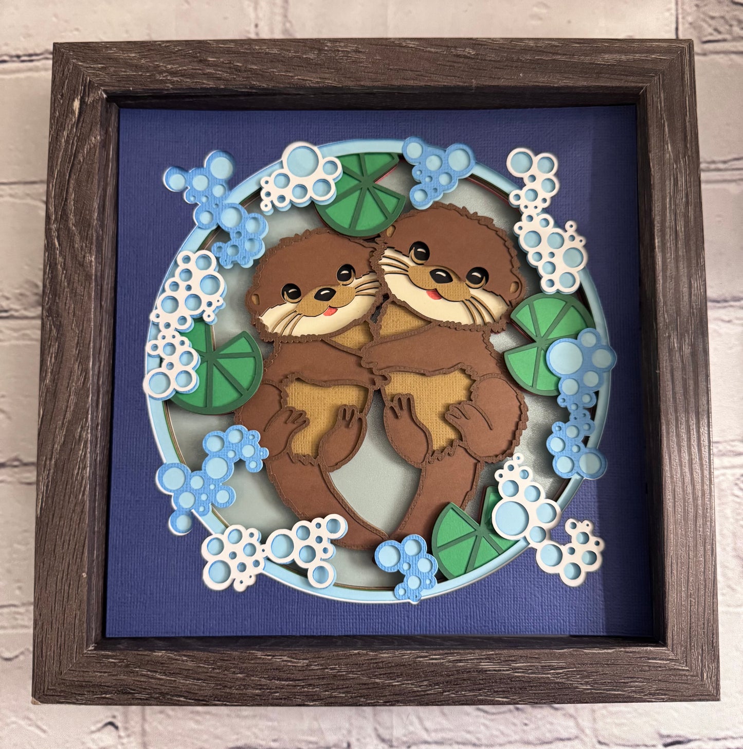 Otter couple 3D paper art in a shadowbox