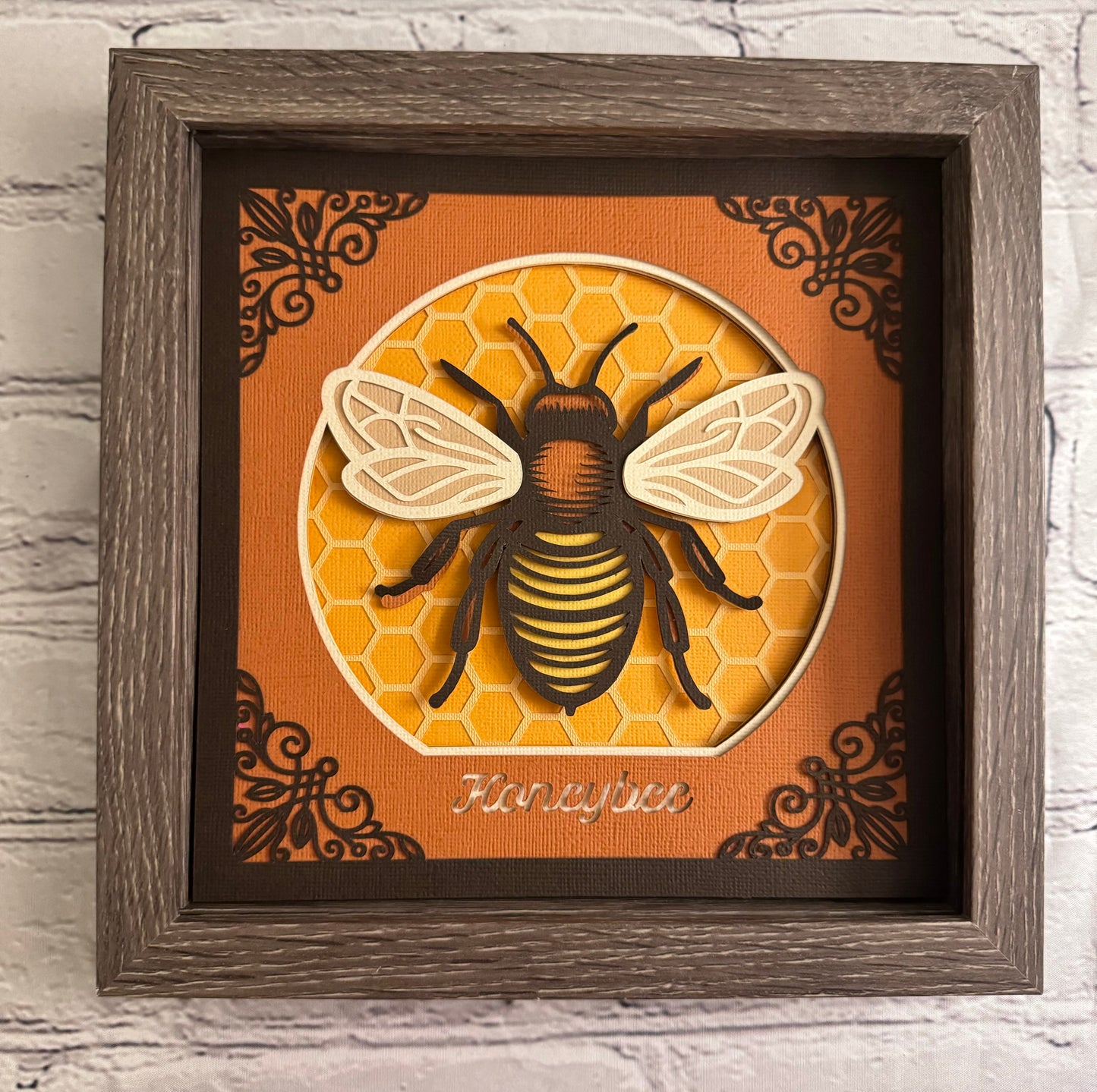Intricate frame bumble bee 3D paper art in a shadowbox