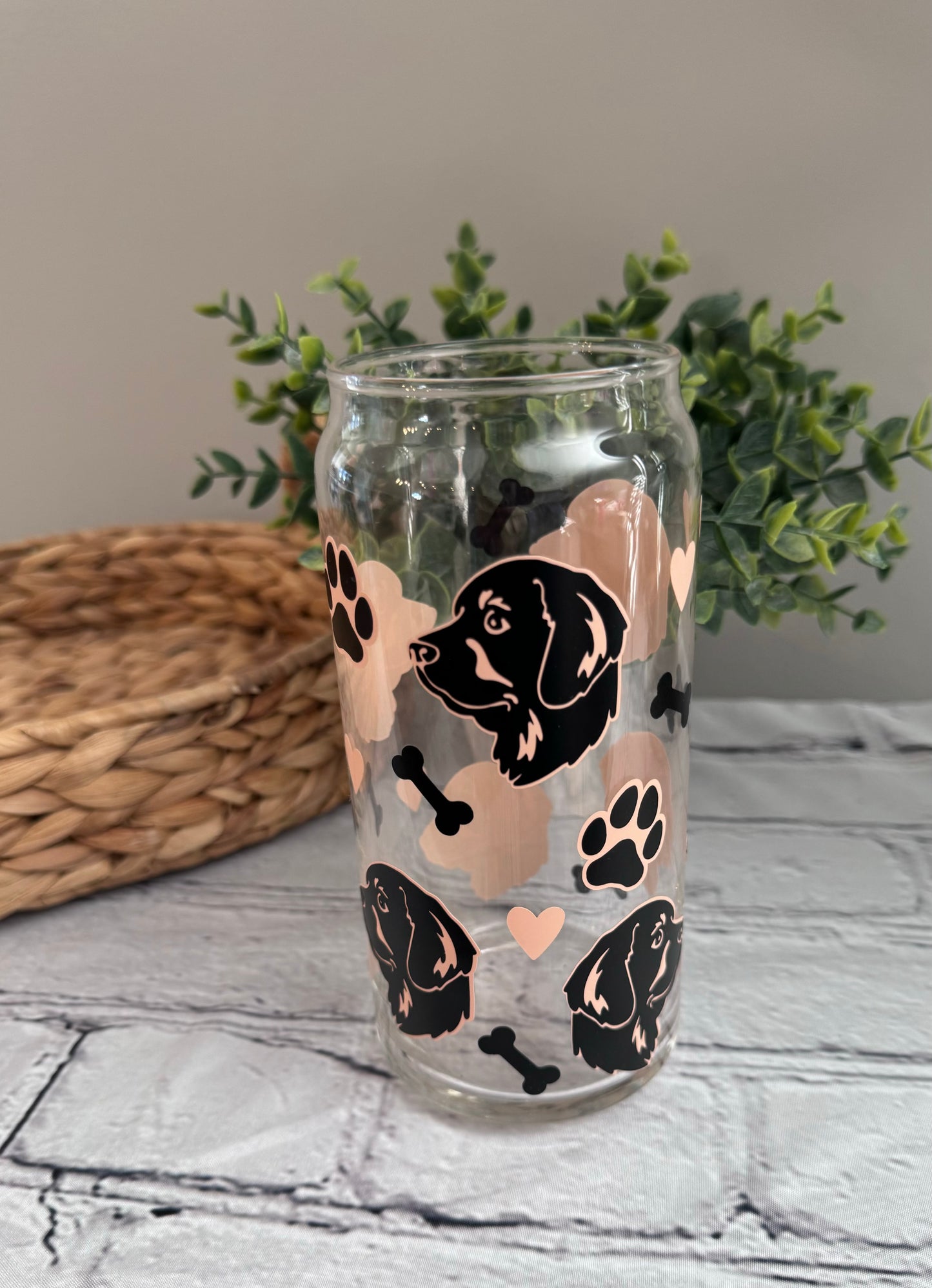 Retriever faces beer can glass