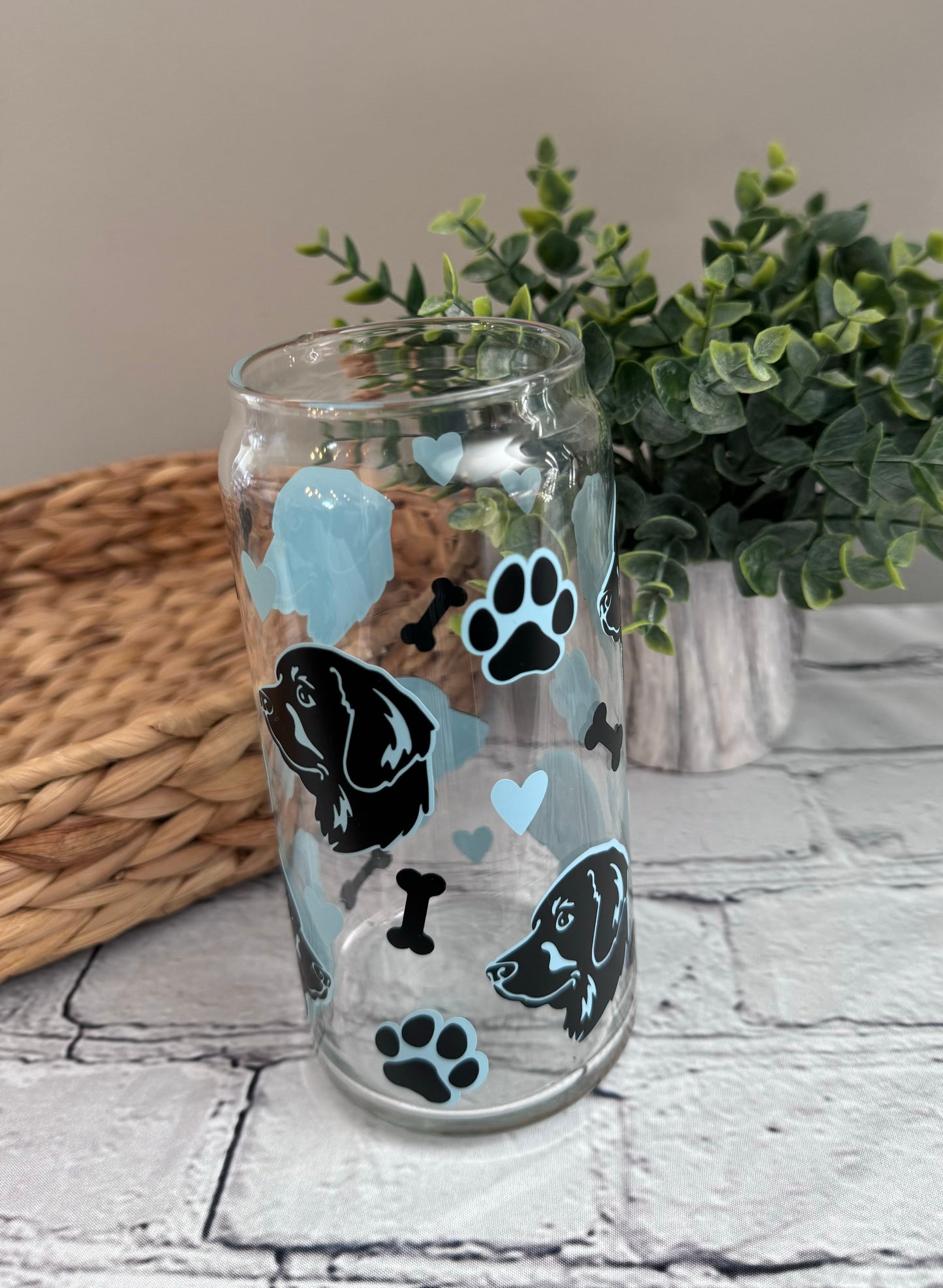 Retriever faces beer can glass