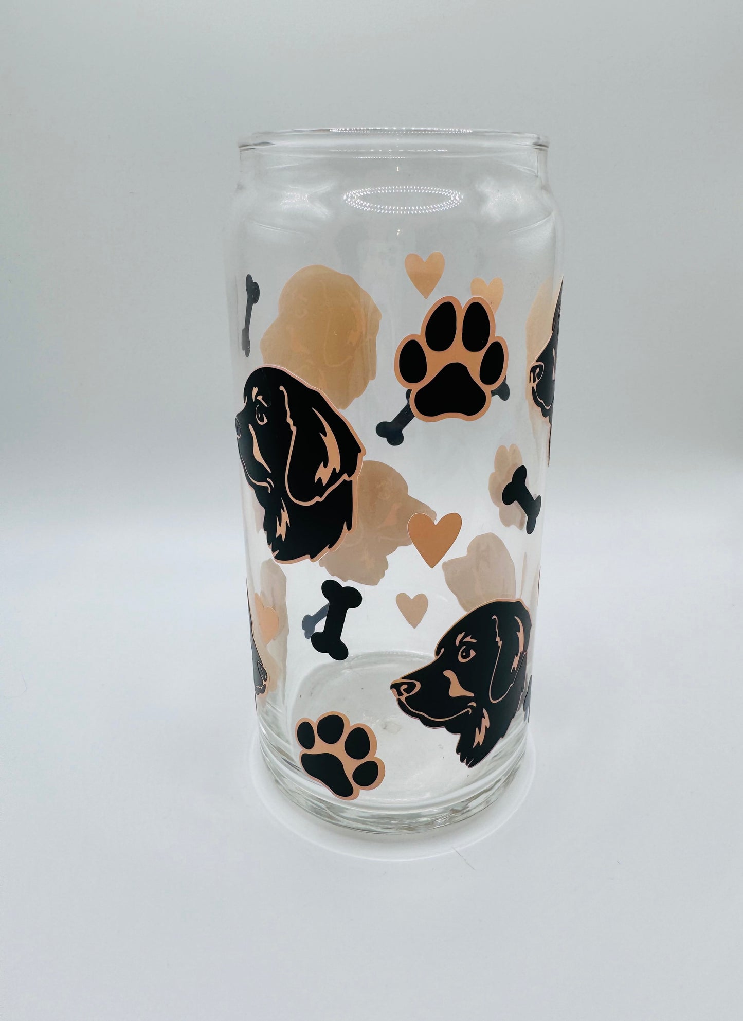 Retriever faces beer can glass