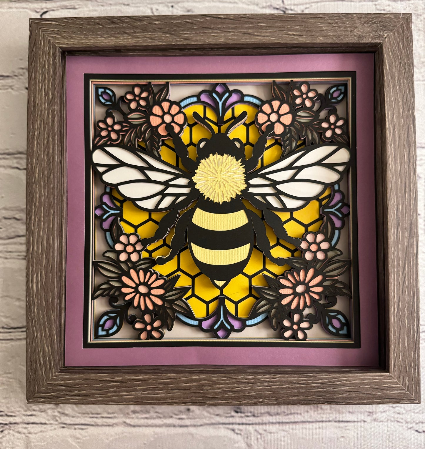 Colorful bee stained glass look 3D paper art in a shadowbox