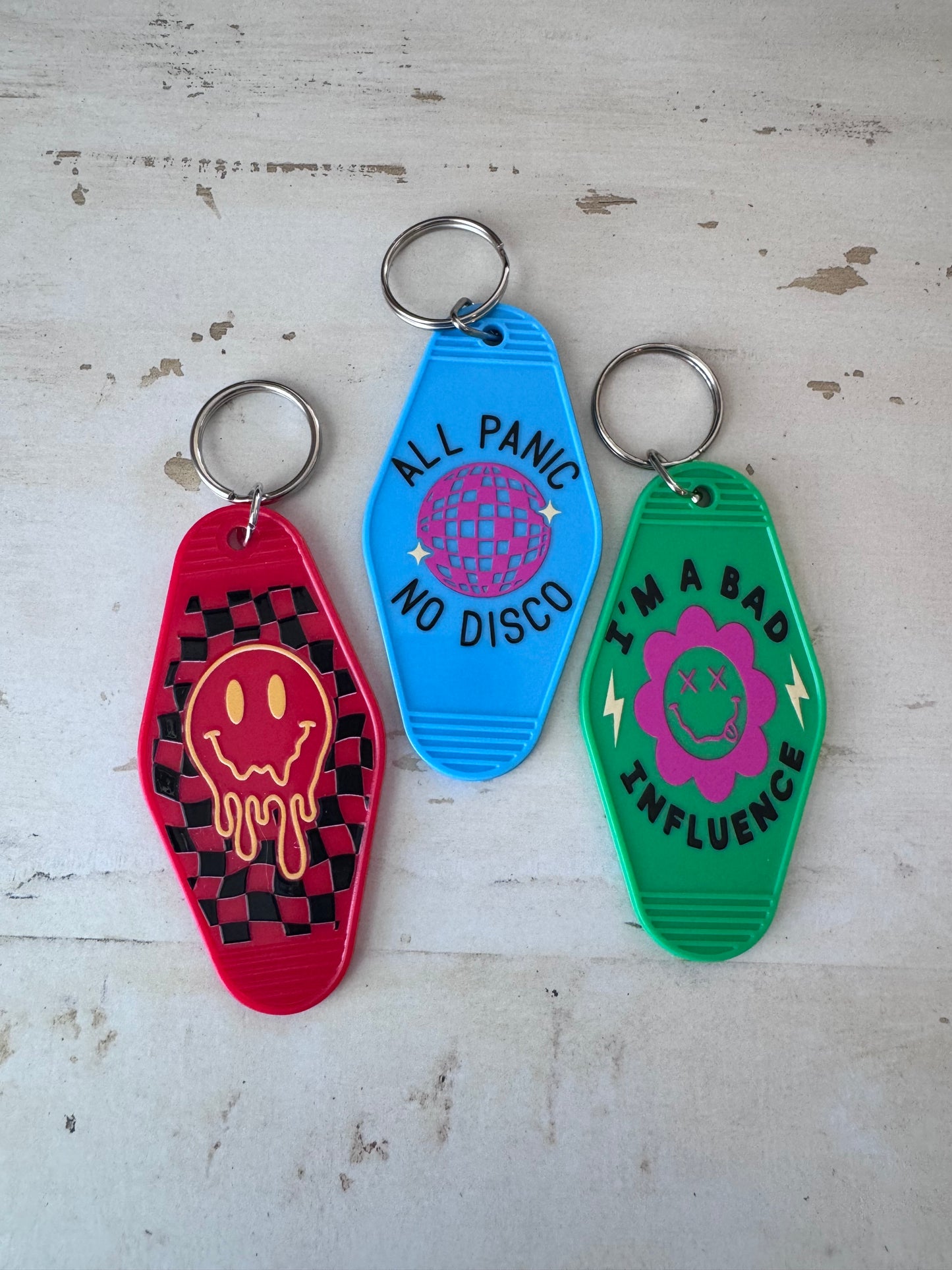 Melting smiley face retro motel keychain