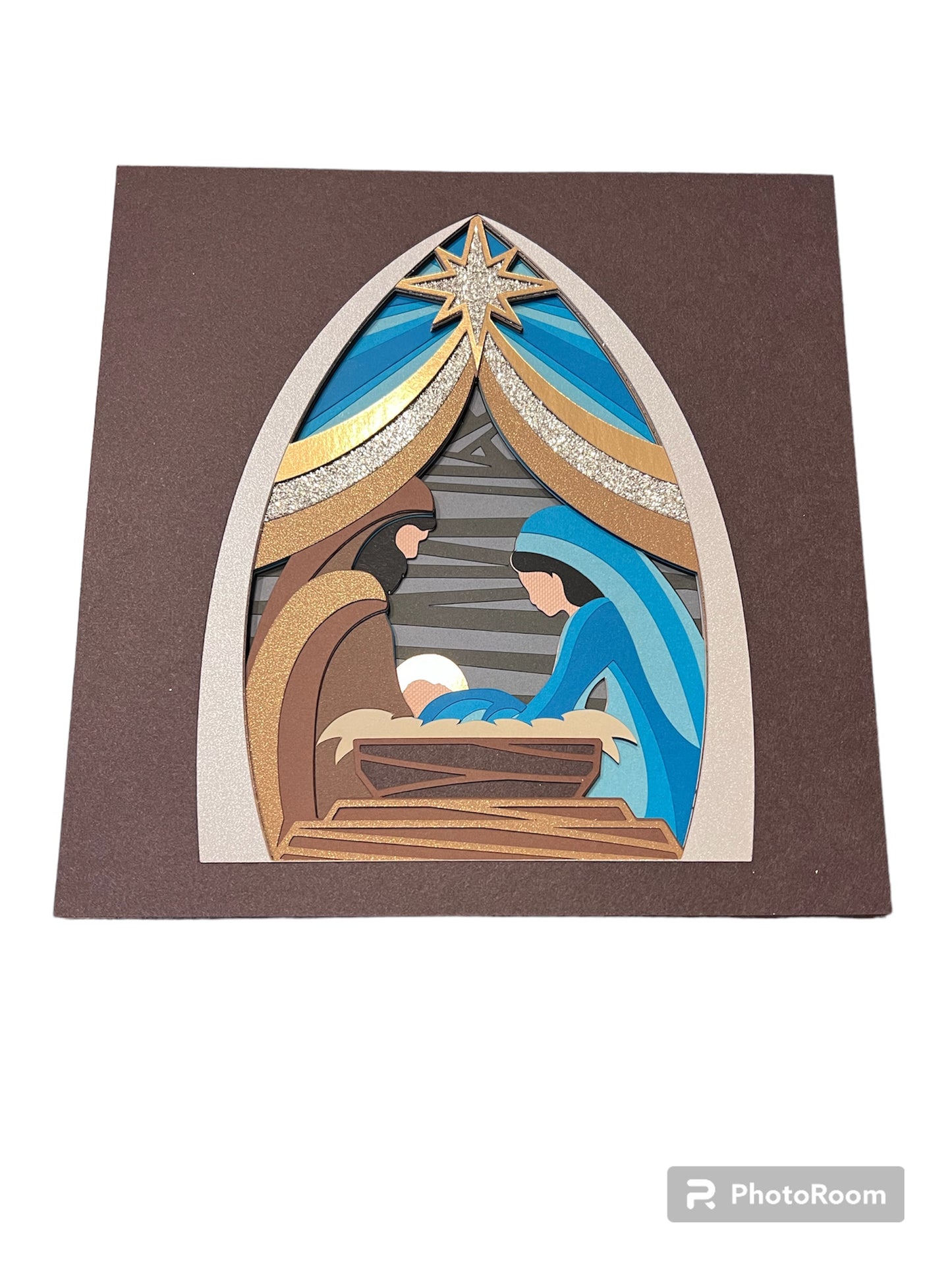 Golden nativity design 3D paper art in a shadowbox