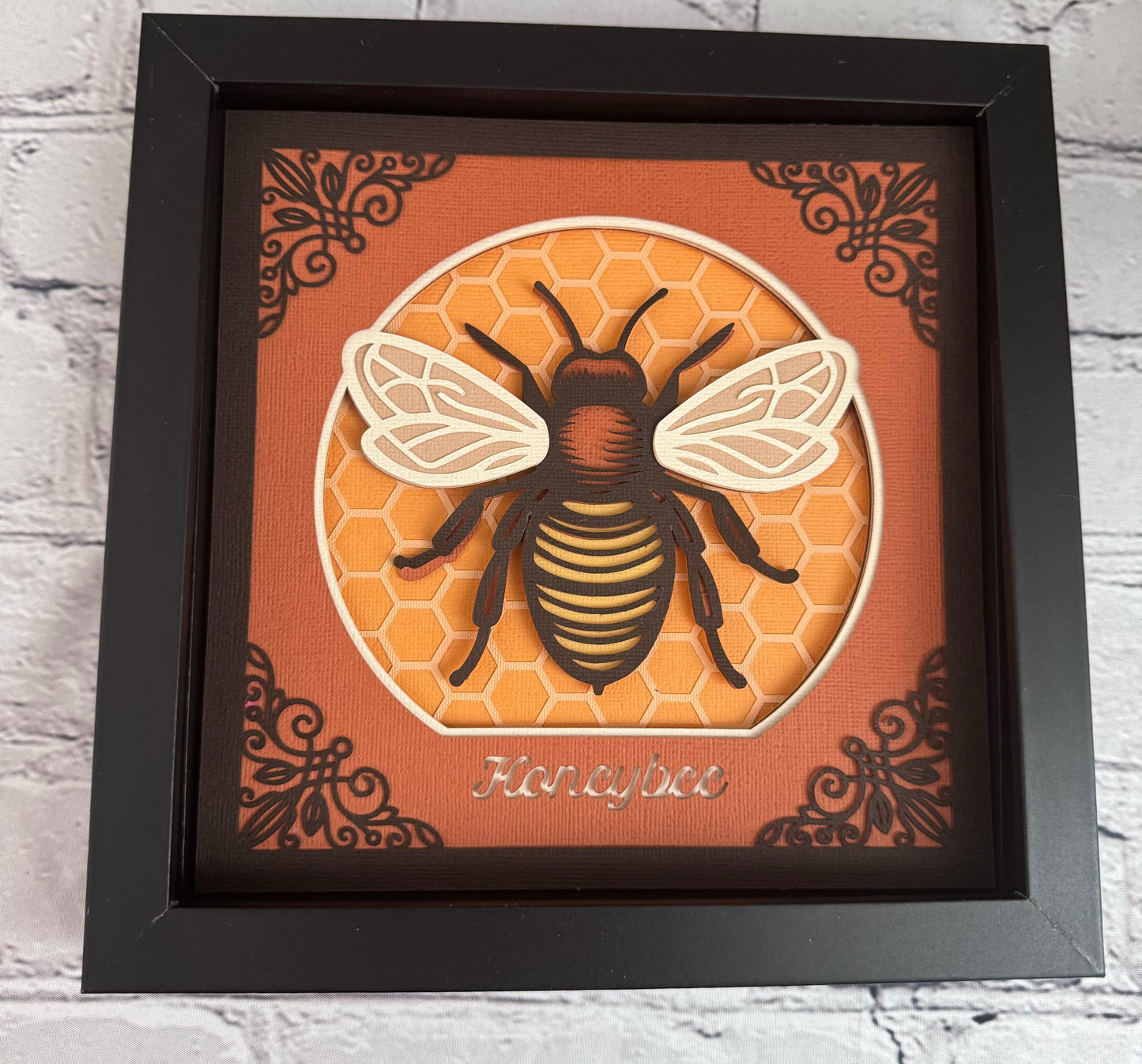Intricate frame bumble bee 3D paper art in a shadowbox