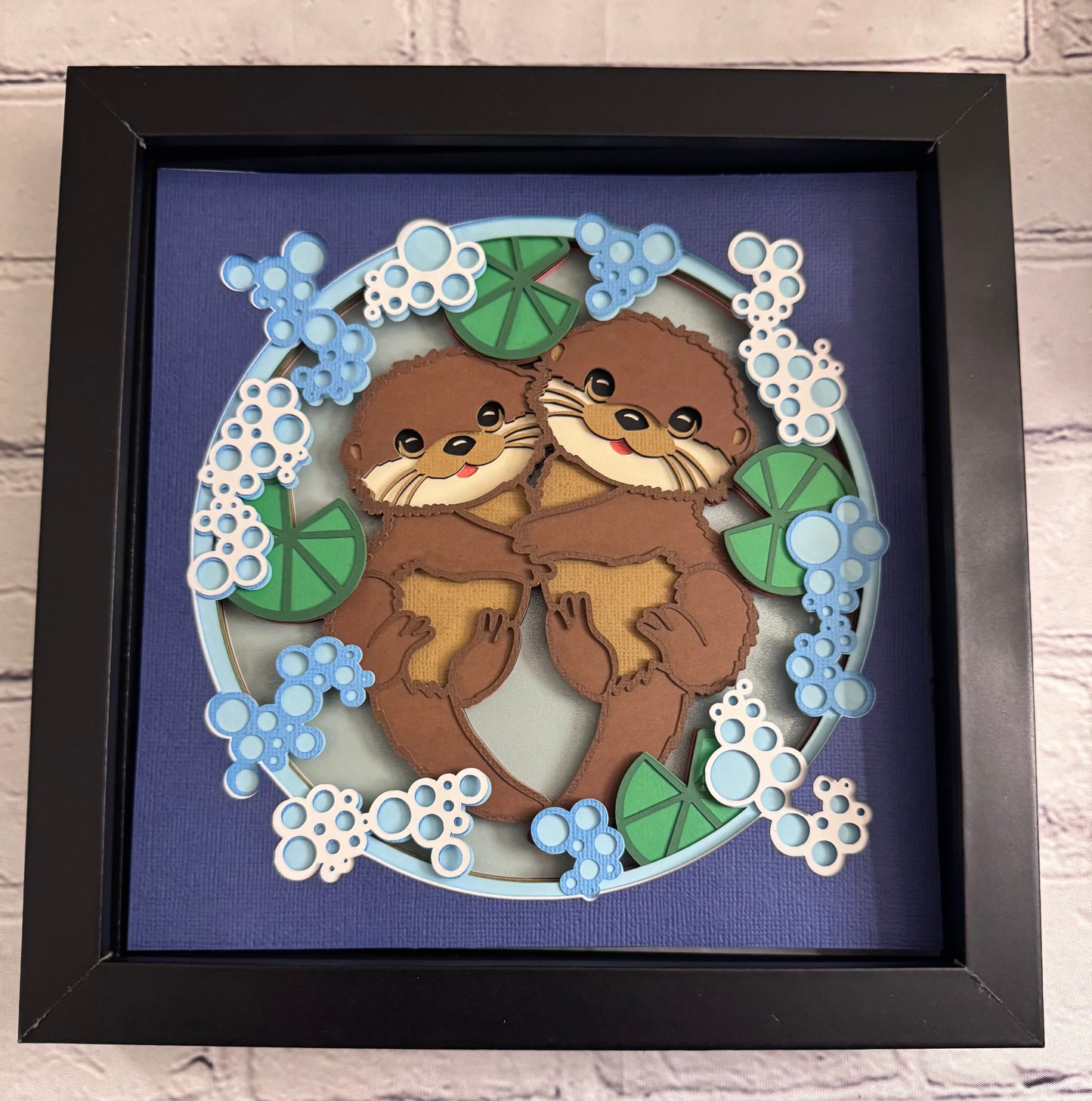 Otter couple 3D paper art in a shadowbox