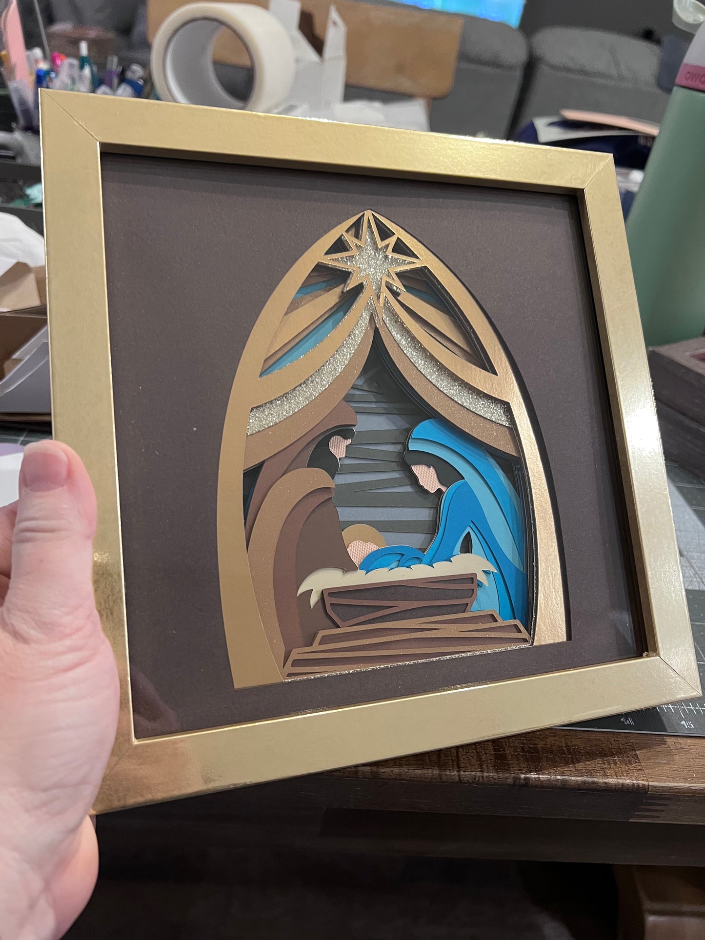 Golden nativity design 3D paper art in a shadowbox