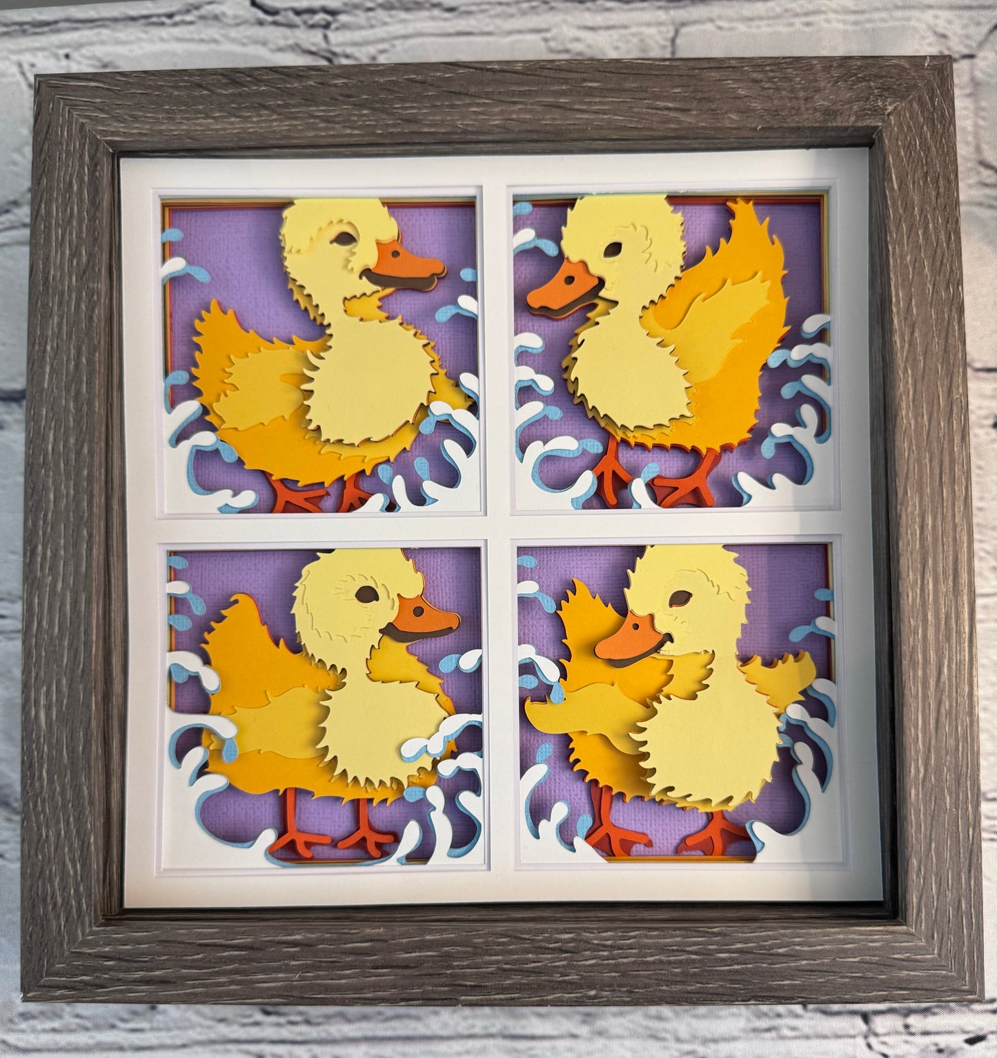 Ducklings in four panels 3D paper art in a shadowbox