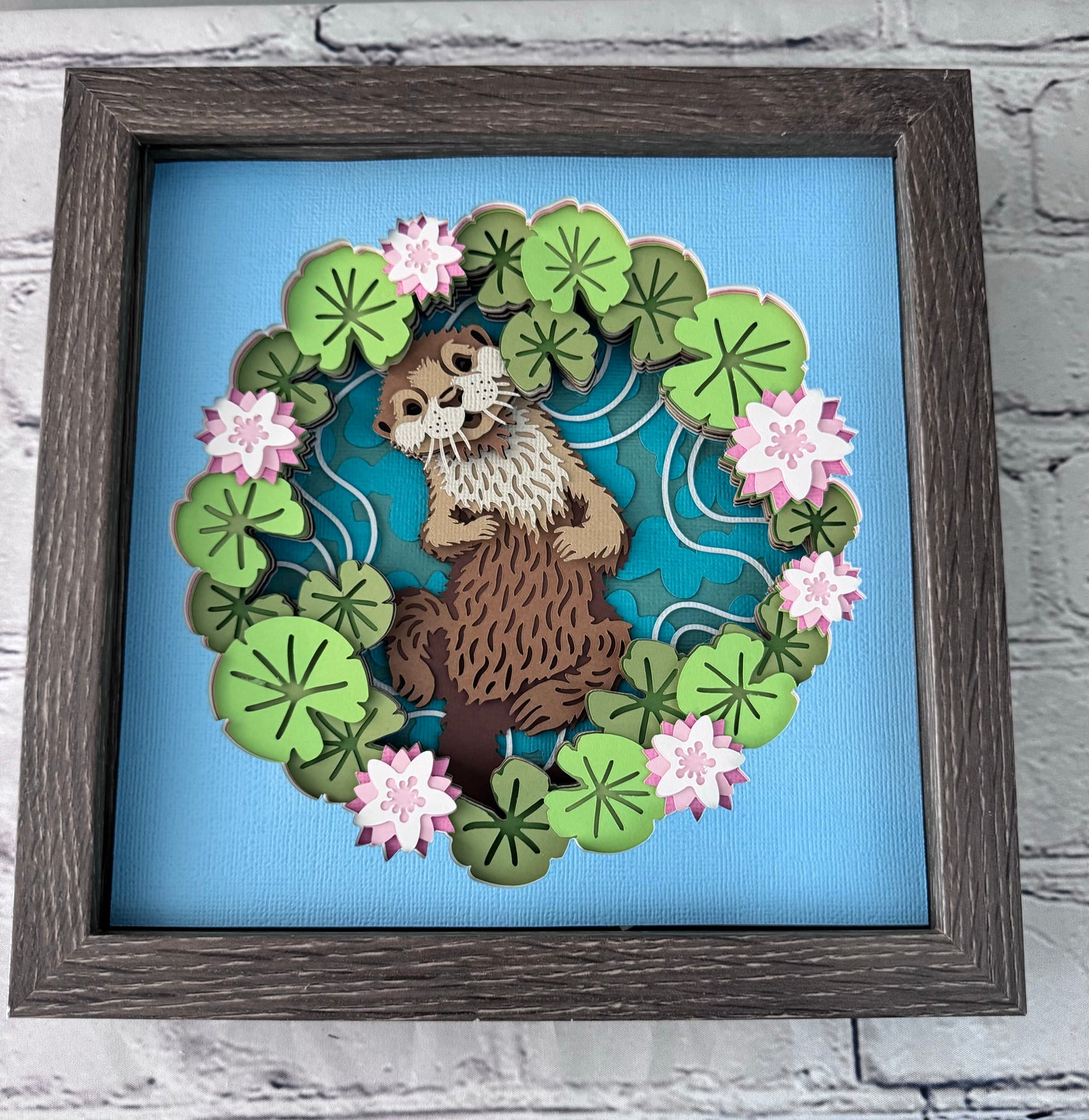 Otter with water lily design 3D paper art in a shadowbox