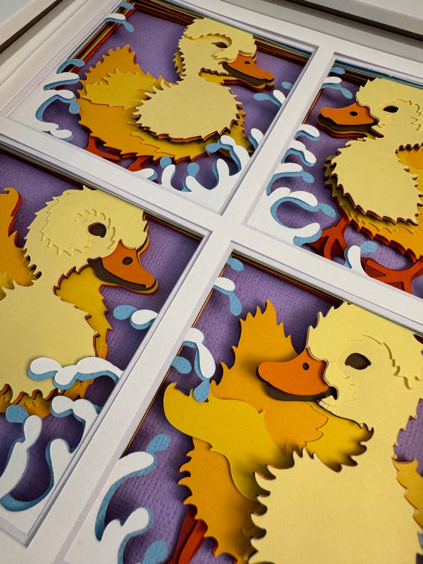 Ducklings in four panels 3D paper art in a shadowbox