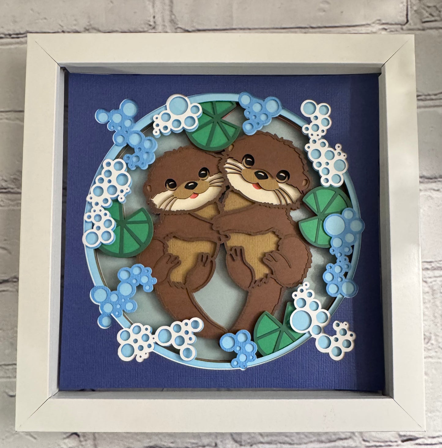 Otter couple 3D paper art in a shadowbox