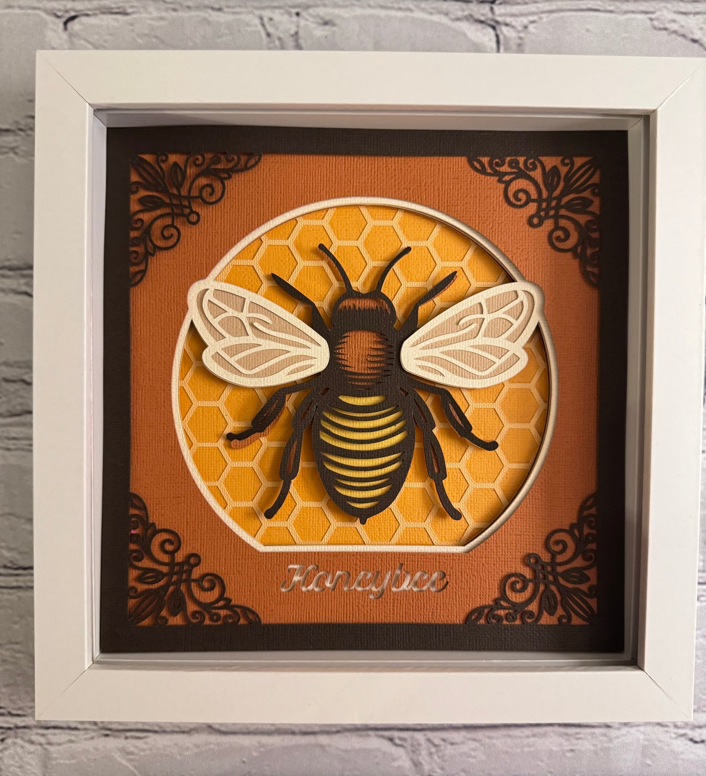 Intricate frame bumble bee 3D paper art in a shadowbox