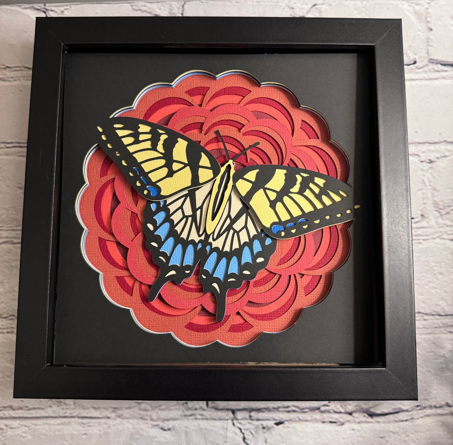 Red flower with blue and yellow butterfly 3D paper art in a shadowbox