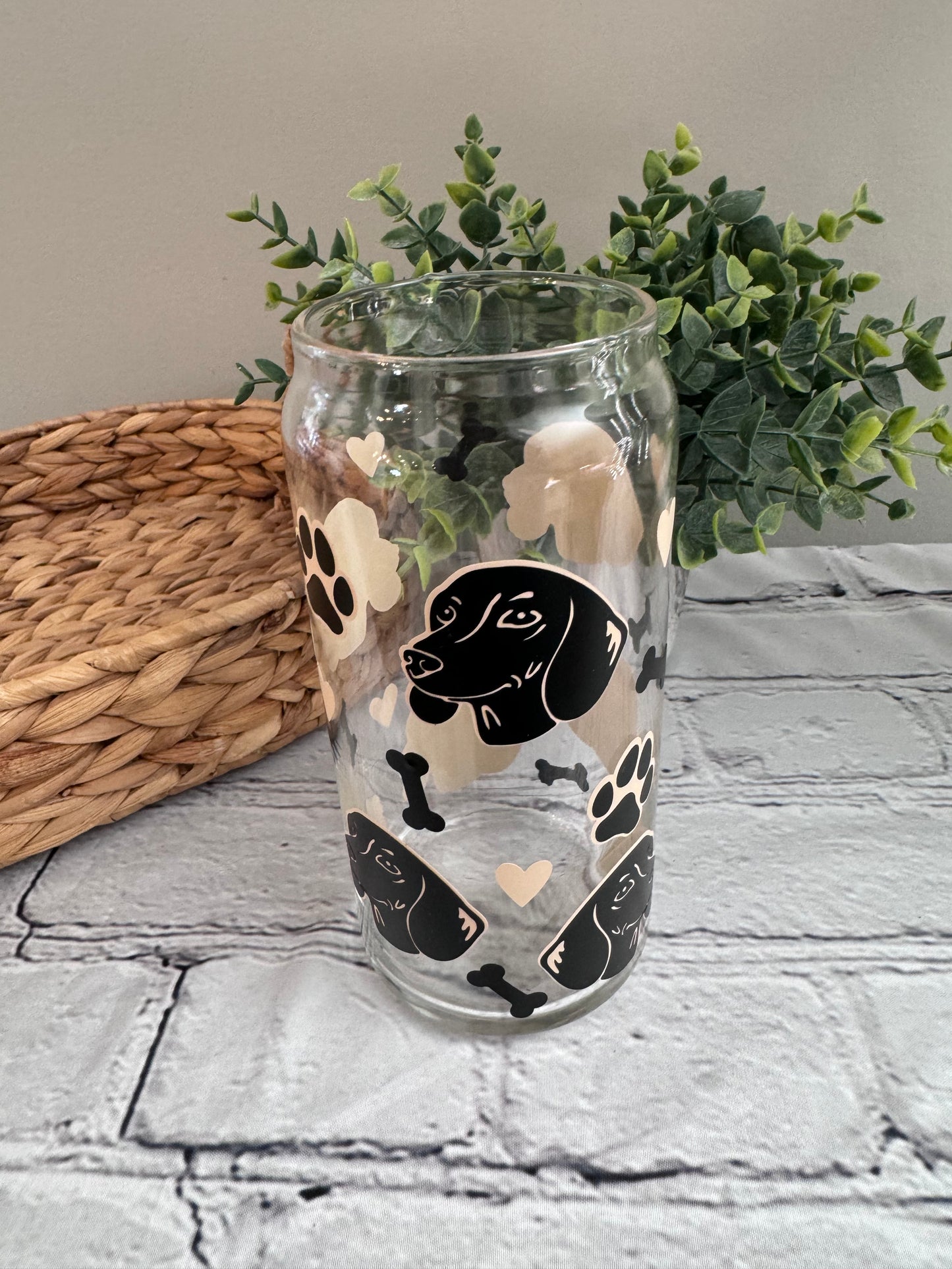 Daushund faces beer can glass