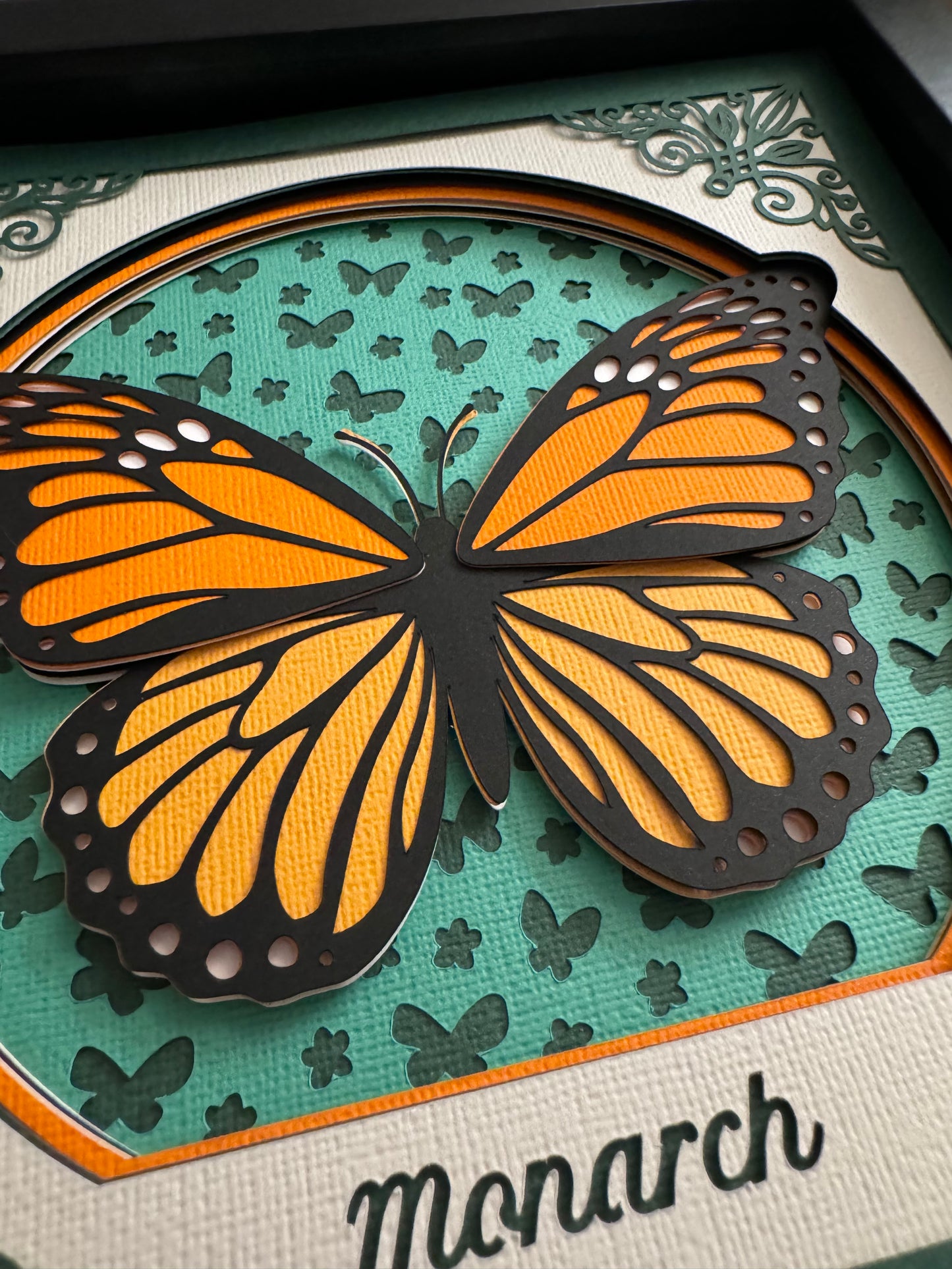 Intricate frame monarch butterfly 3D paper art in a shadowbox