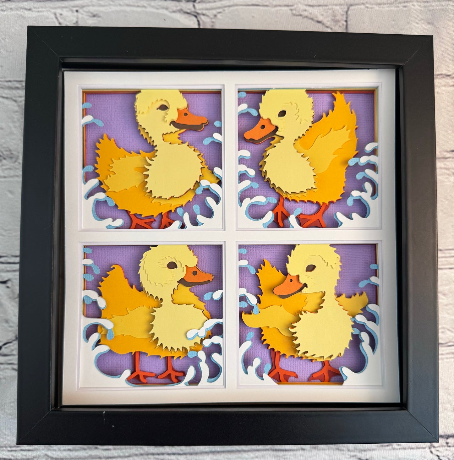 Ducklings in four panels 3D paper art in a shadowbox