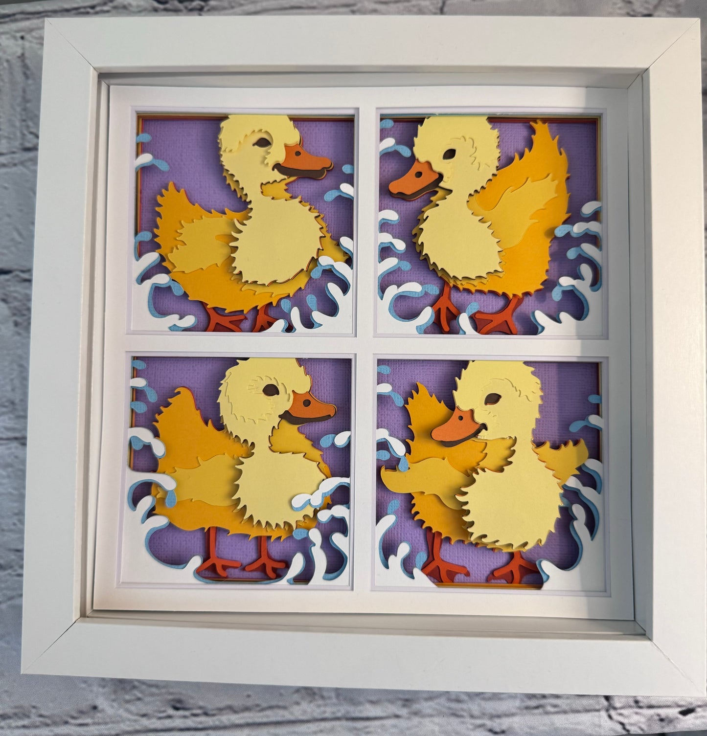 Ducklings in four panels 3D paper art in a shadowbox