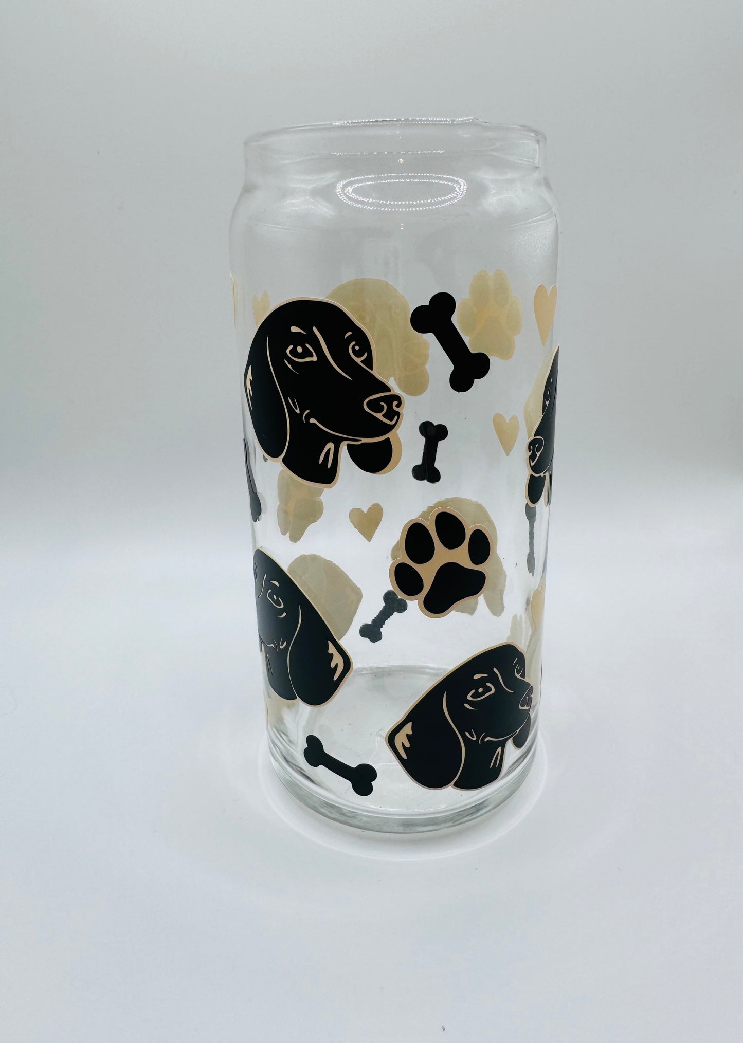 Daushund faces beer can glass