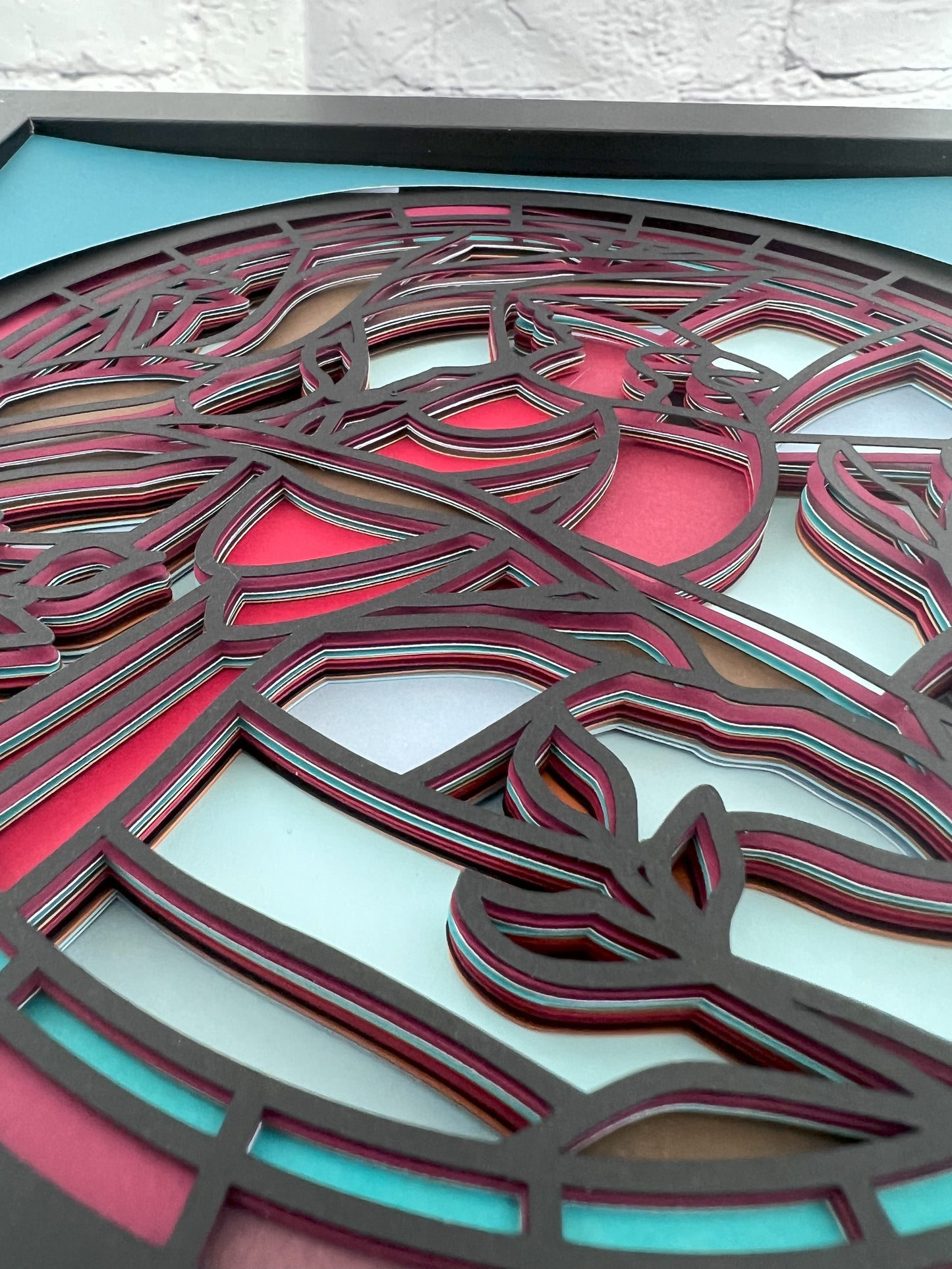 Stained glass cardinal 3D paper art in a shadowbox