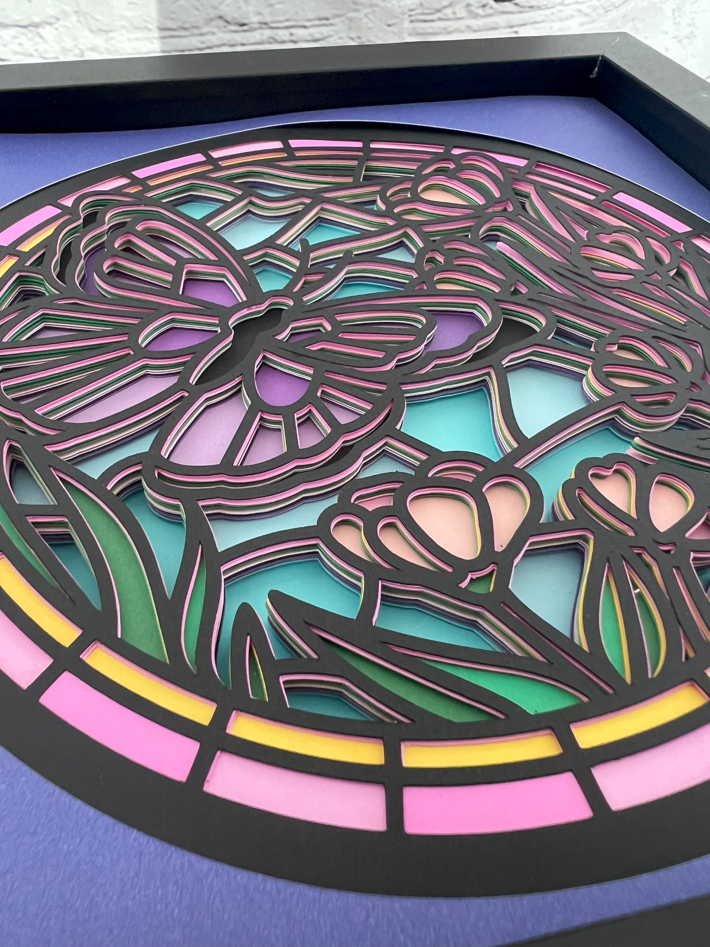 Stained glass butterfly 3D paper art in a shadowbox