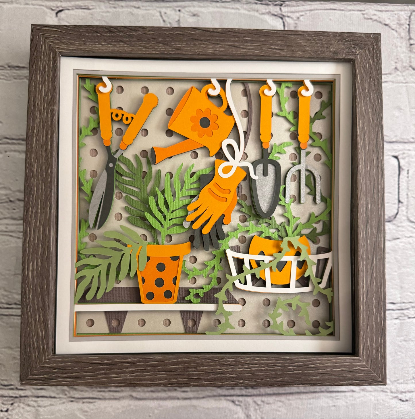 Gardening scene board with tools 3D paper art in a shadowbox