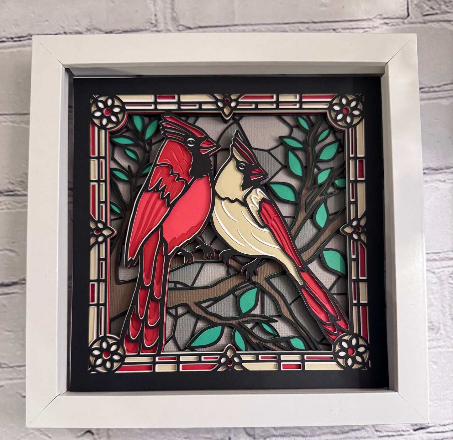 Stained glass cardinals 3D paper art in a shadowbox