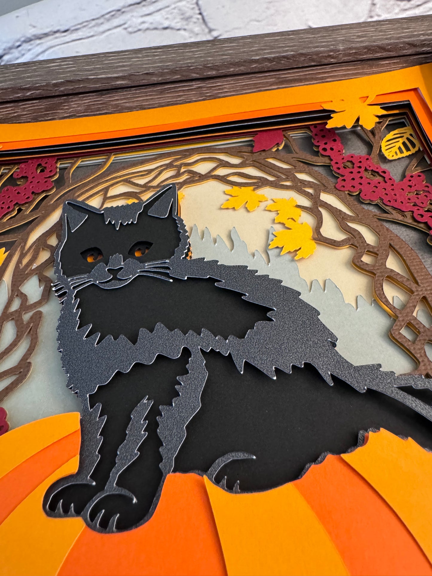 Black cat on a pumpkin 3D paper art in a shadowbox