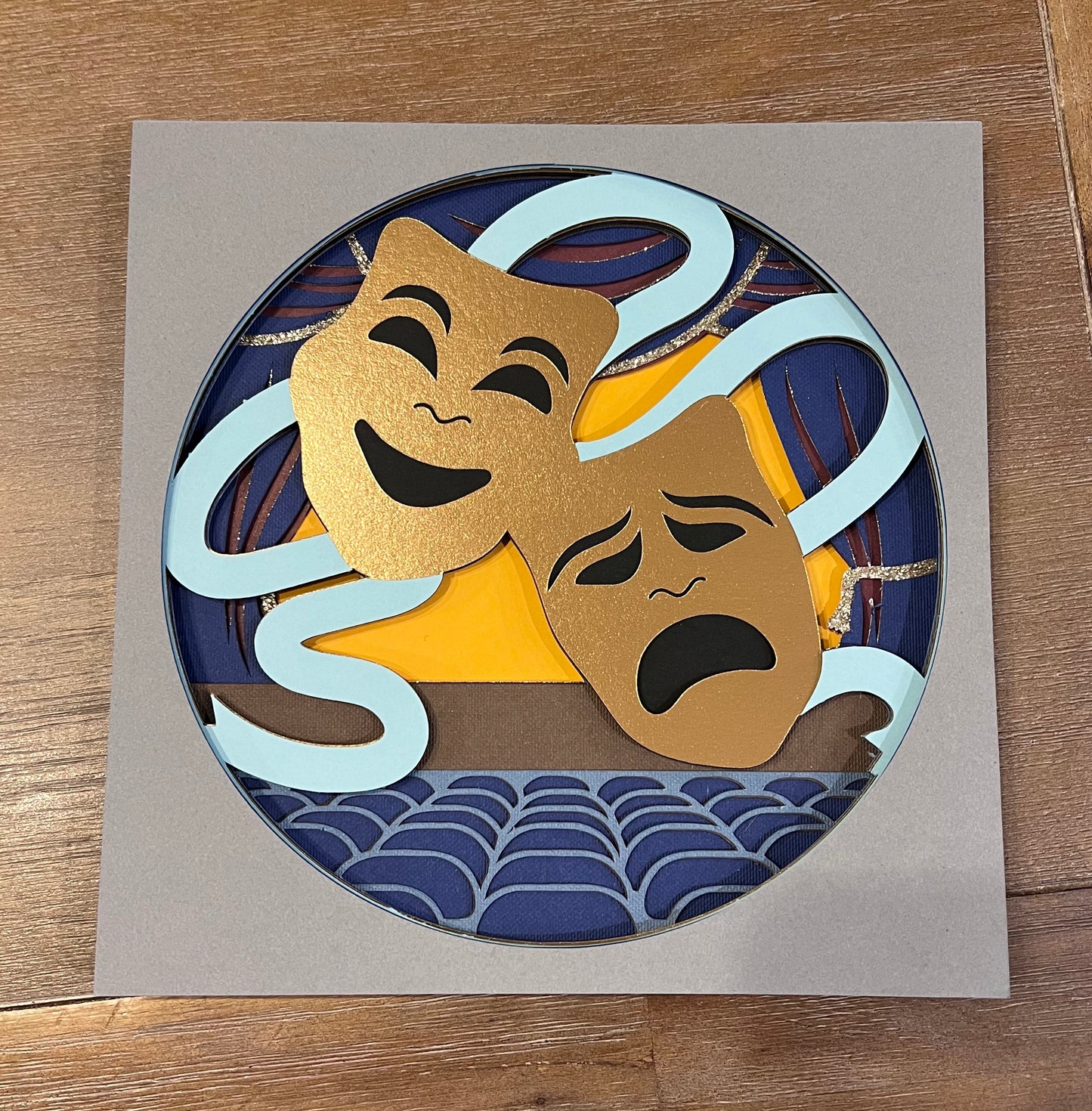 Theater comedy and tragedy masks 3D paper art in a shadowbox