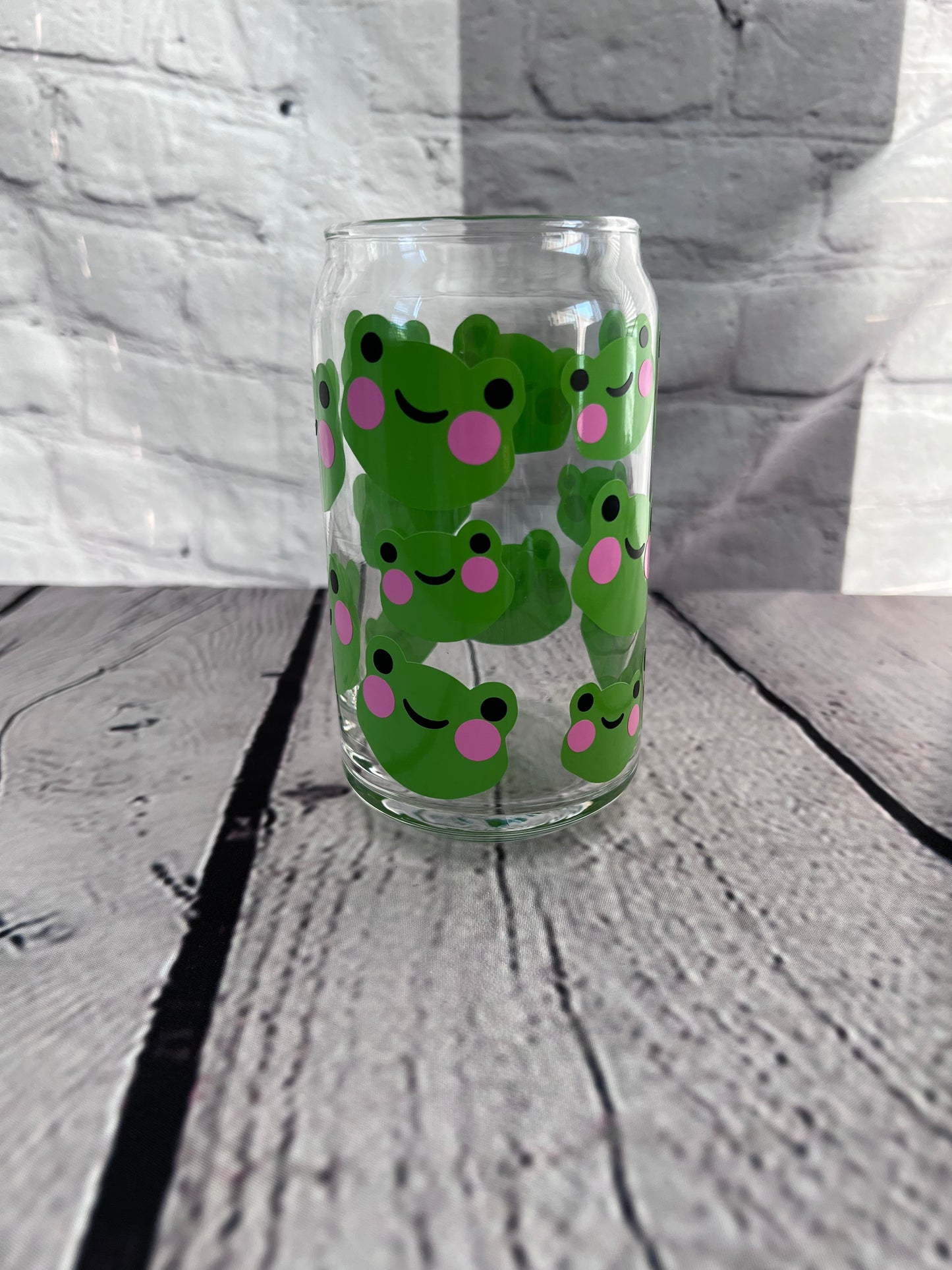 Frog faces beer can glass