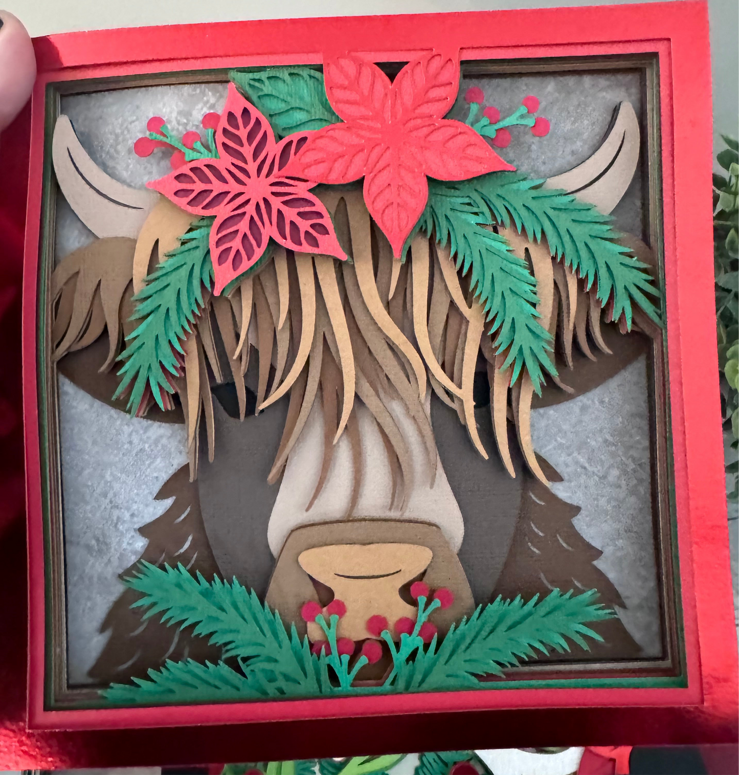 Highland cow with poinsettia 3D paper art in a shadowbox