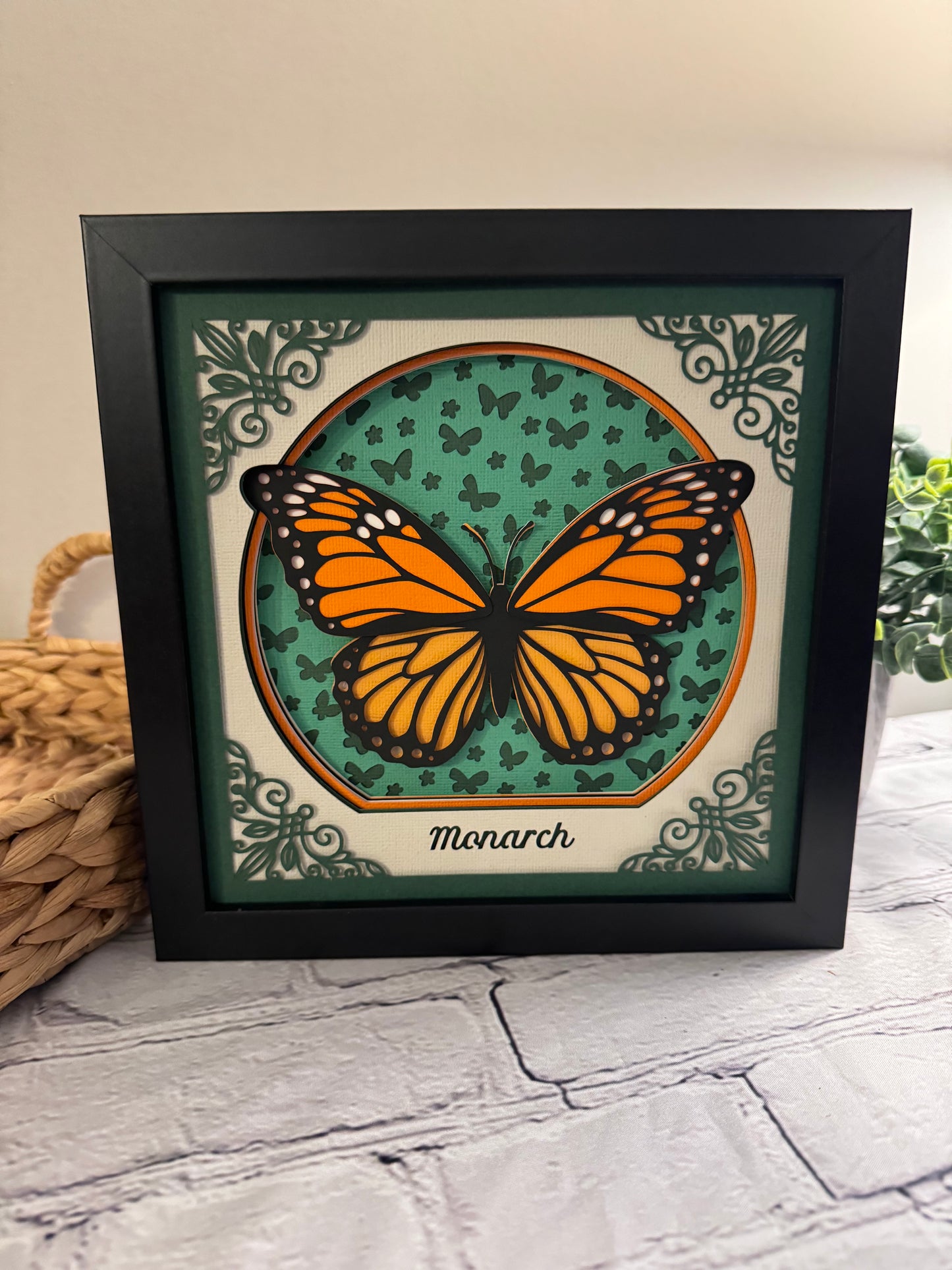 Intricate frame monarch butterfly 3D paper art in a shadowbox
