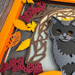 Black cat on a pumpkin 3D paper art in a shadowbox