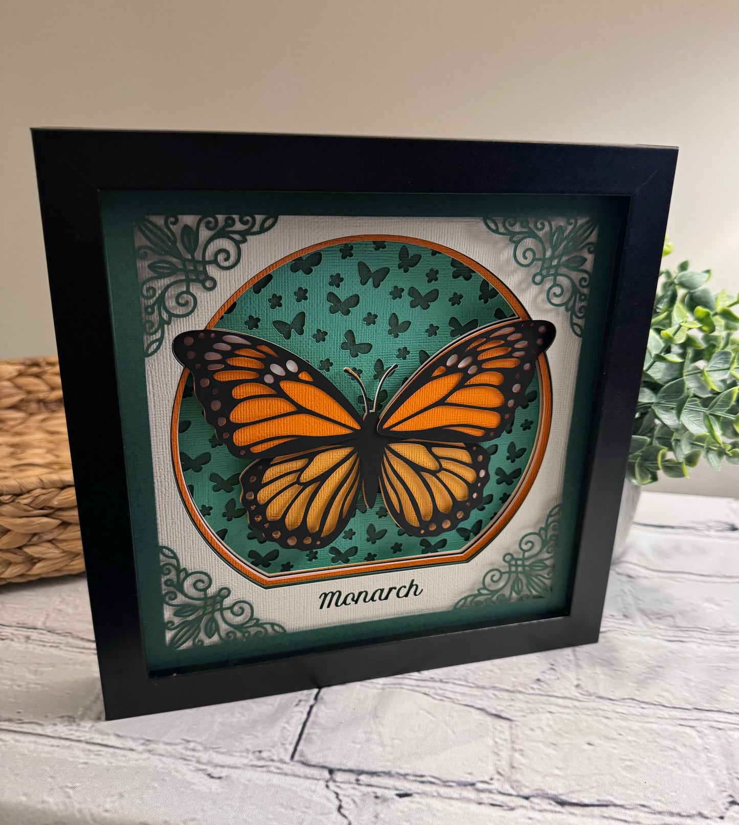 Intricate frame monarch butterfly 3D paper art in a shadowbox