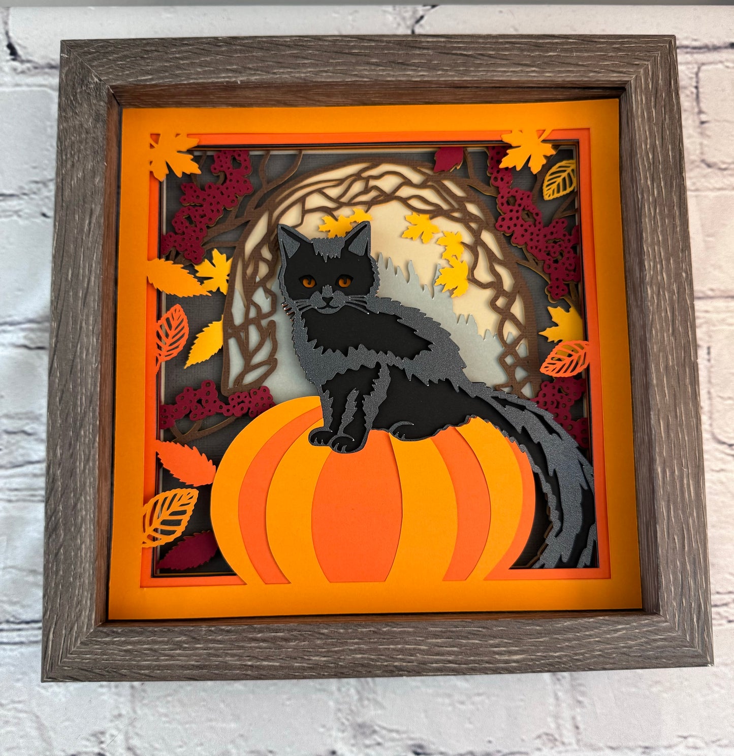 Black cat on a pumpkin 3D paper art in a shadowbox