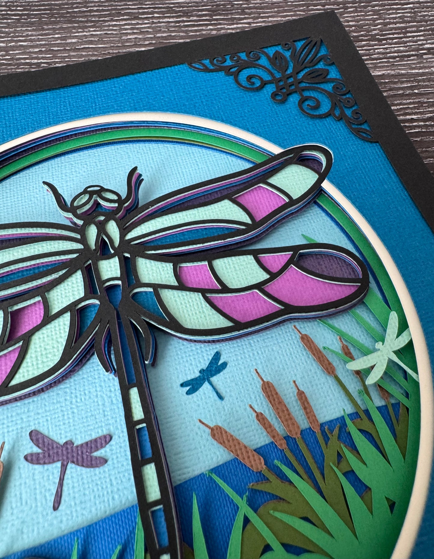 Intricate frame dragonfly 3D paper art in a shadowbox