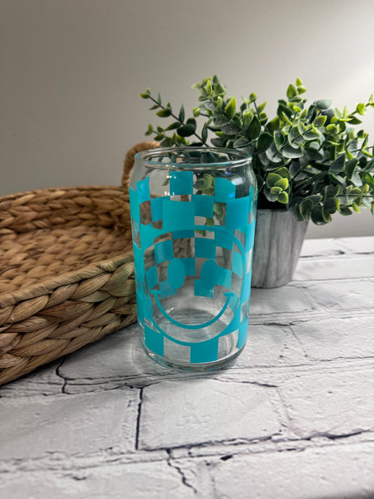 Checkerboard smiley face with oval eyes beer can glass