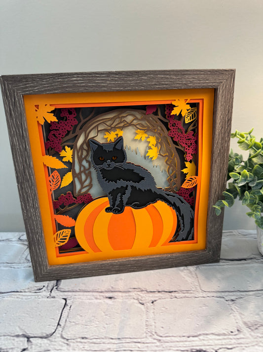 Black cat on a pumpkin 3D paper art in a shadowbox