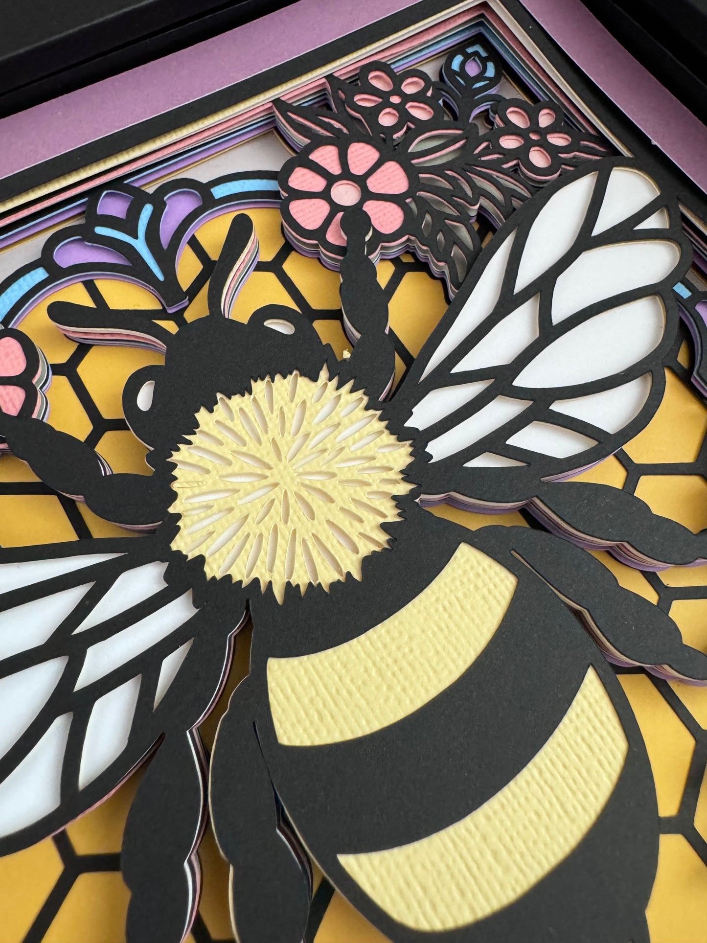 Colorful bee stained glass look 3D paper art in a shadowbox