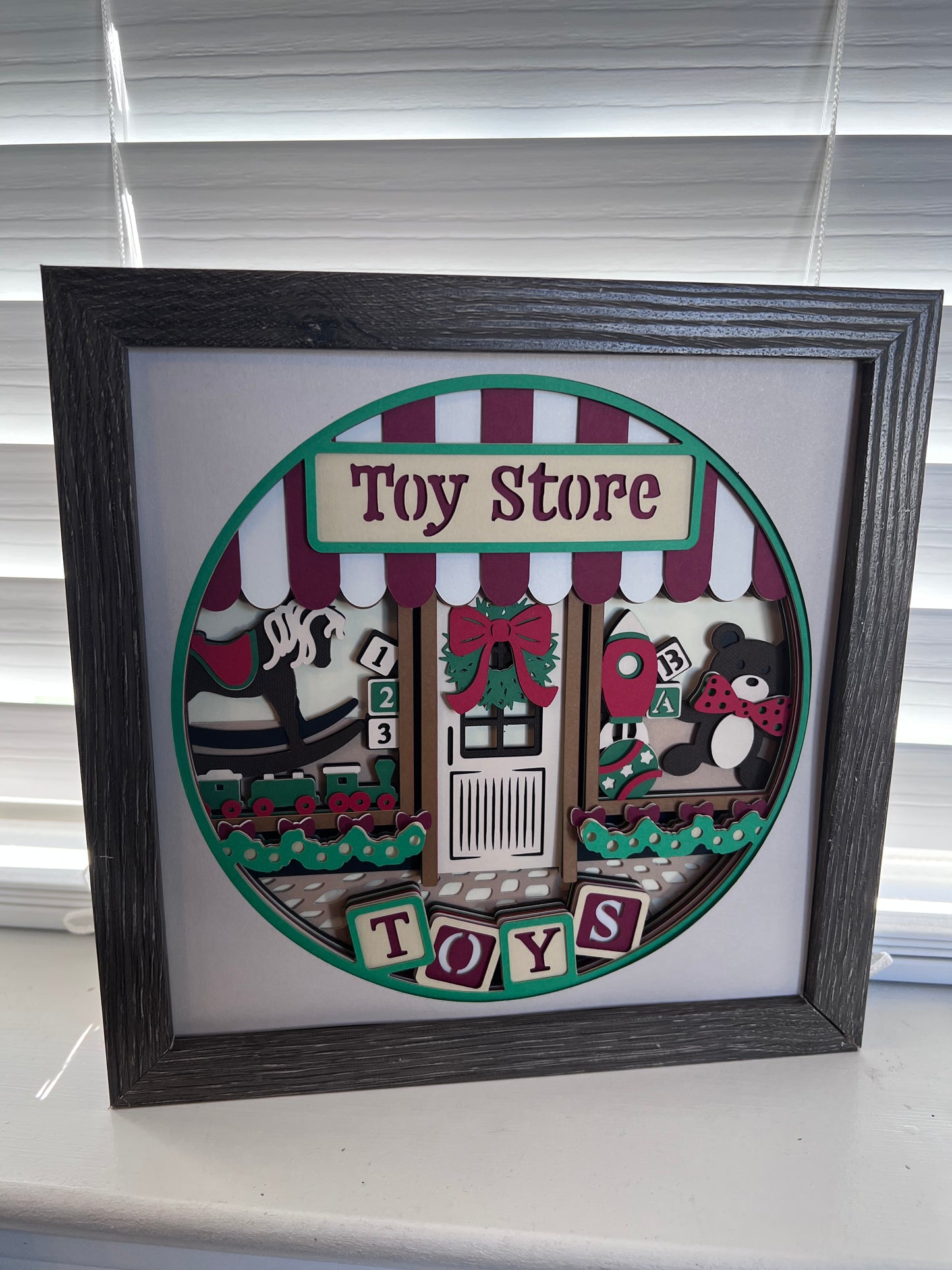 Toy store 3D paper art in a shadowbox