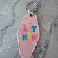 Let them retro motel keychain