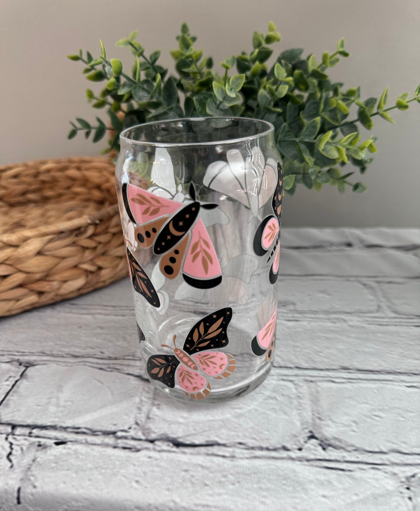 Pink and black moth beer can glass