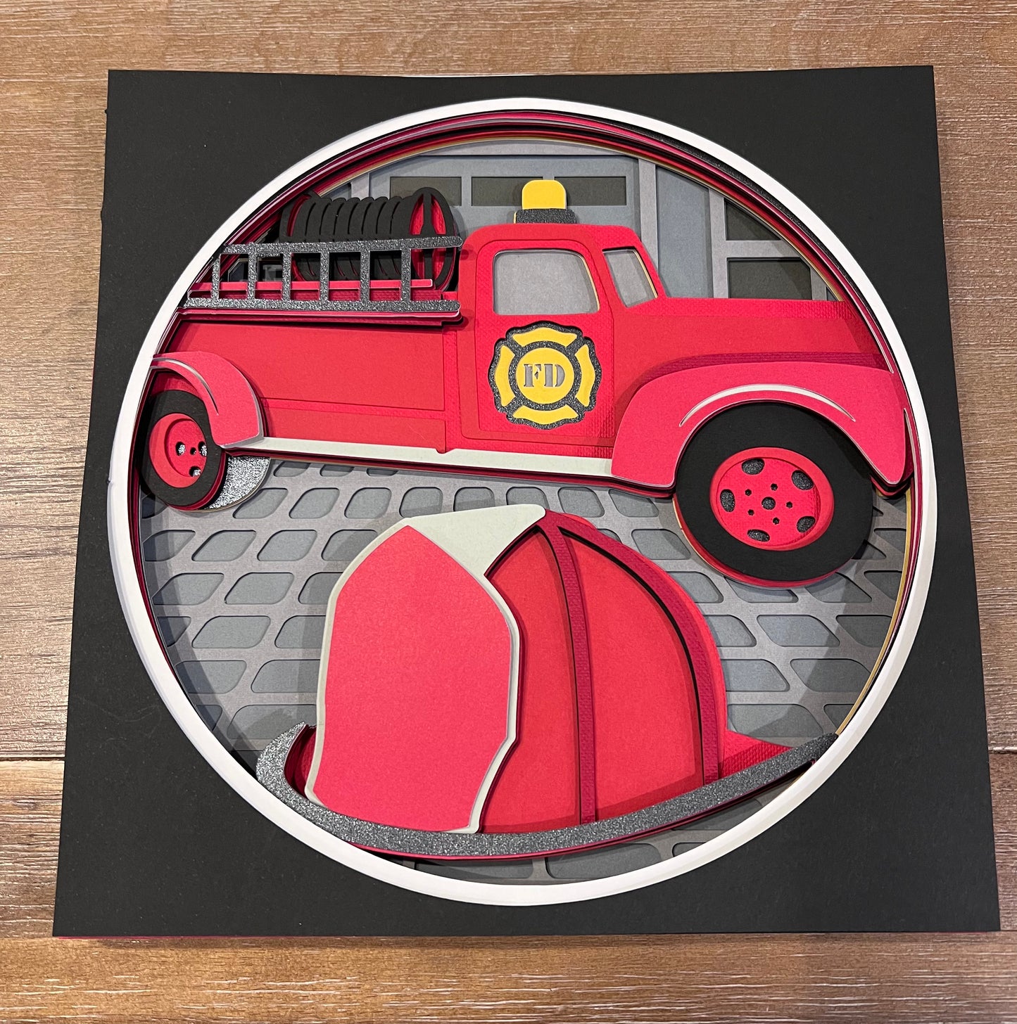 Fire station with truck and helmet 3D paper art in a shadowbox