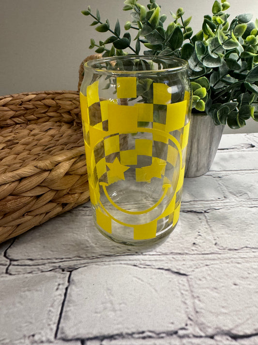 Checkerboard smiley face with star eyes beer can glass