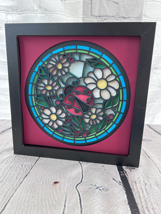 Stained glass ladybug 3D paper art in a shadowbox