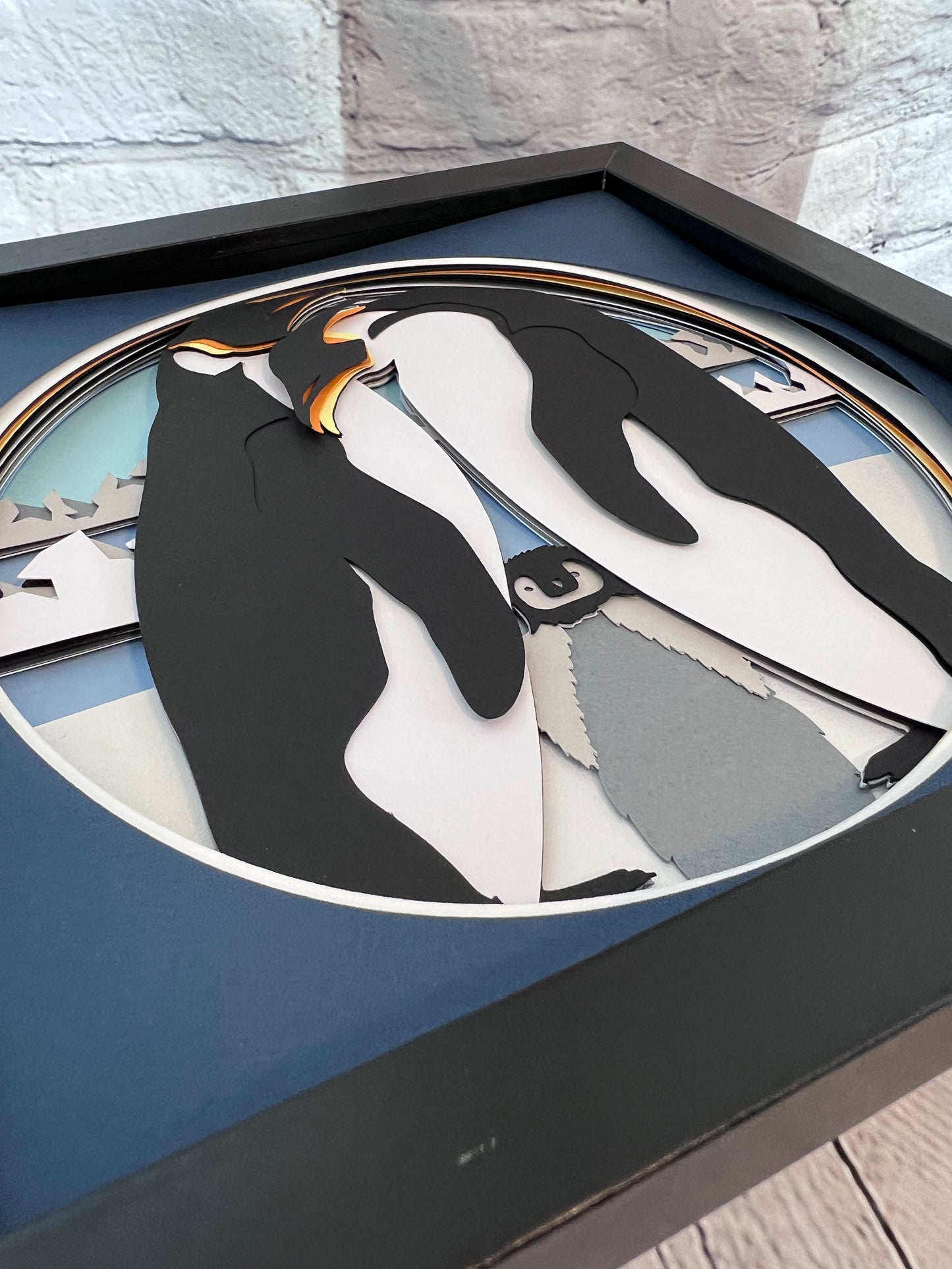 Penguin family 3D paper art in a shadowbox