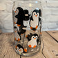 Penguins at play beer can glass