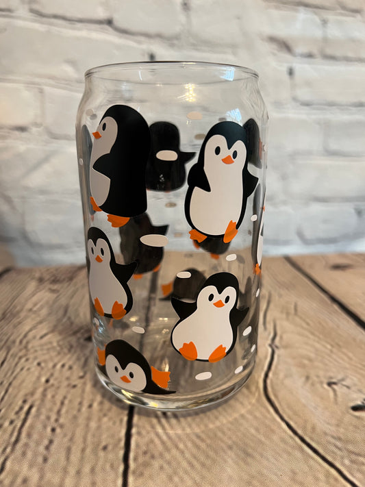 Penguins at play beer can glass